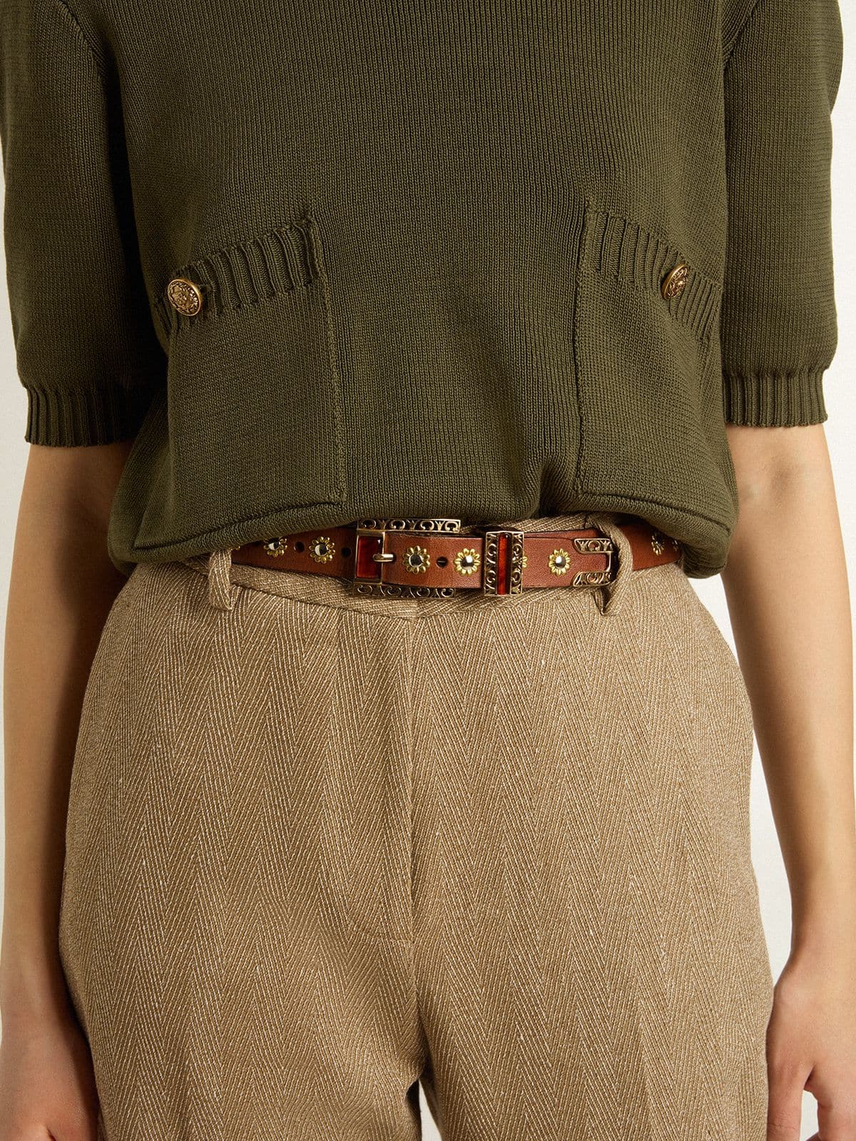 Brown leather belt with golden floral studs and amber inserts