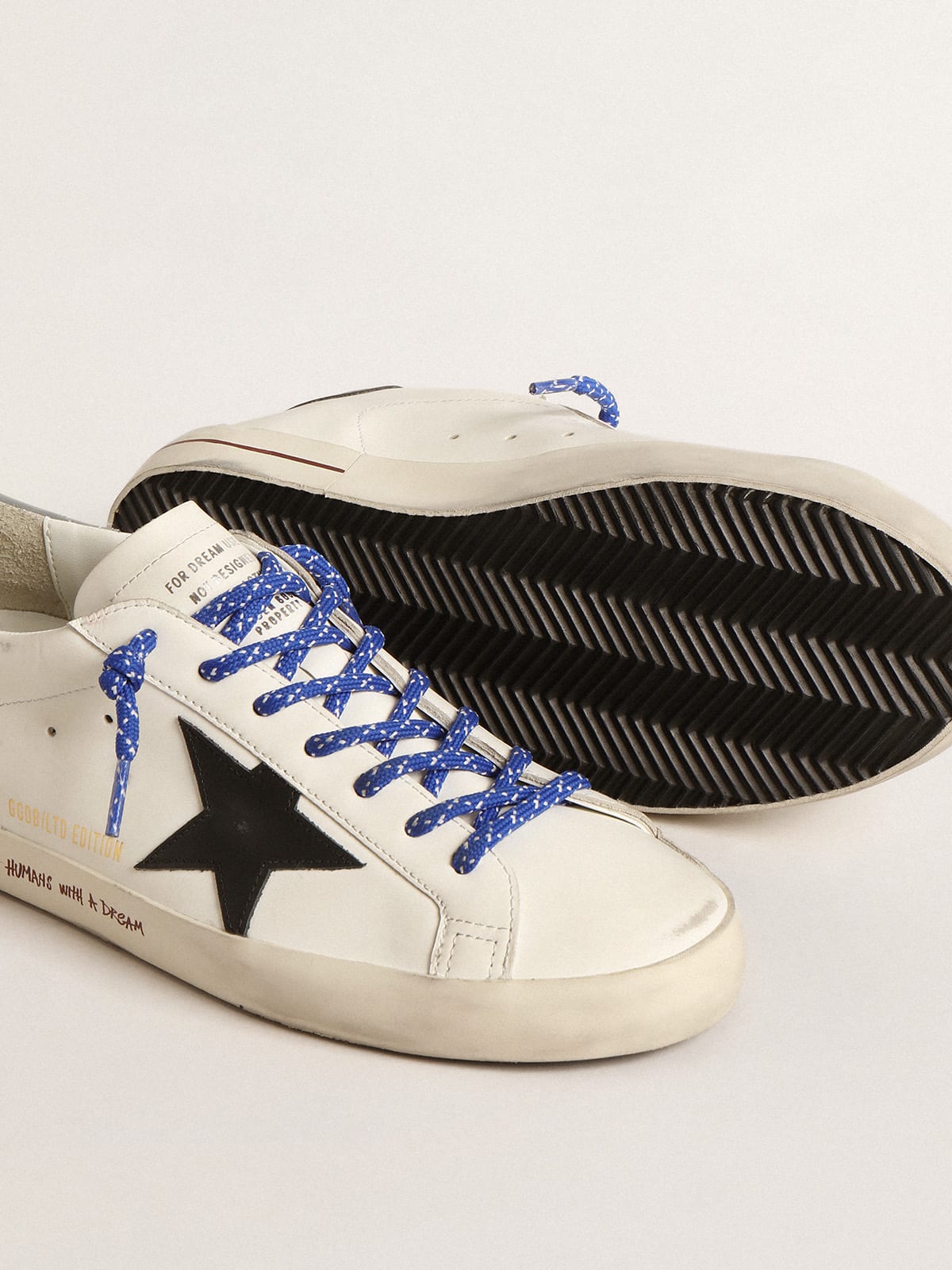 Super-Star LTD con stella in pelle nera e talloncino grigio