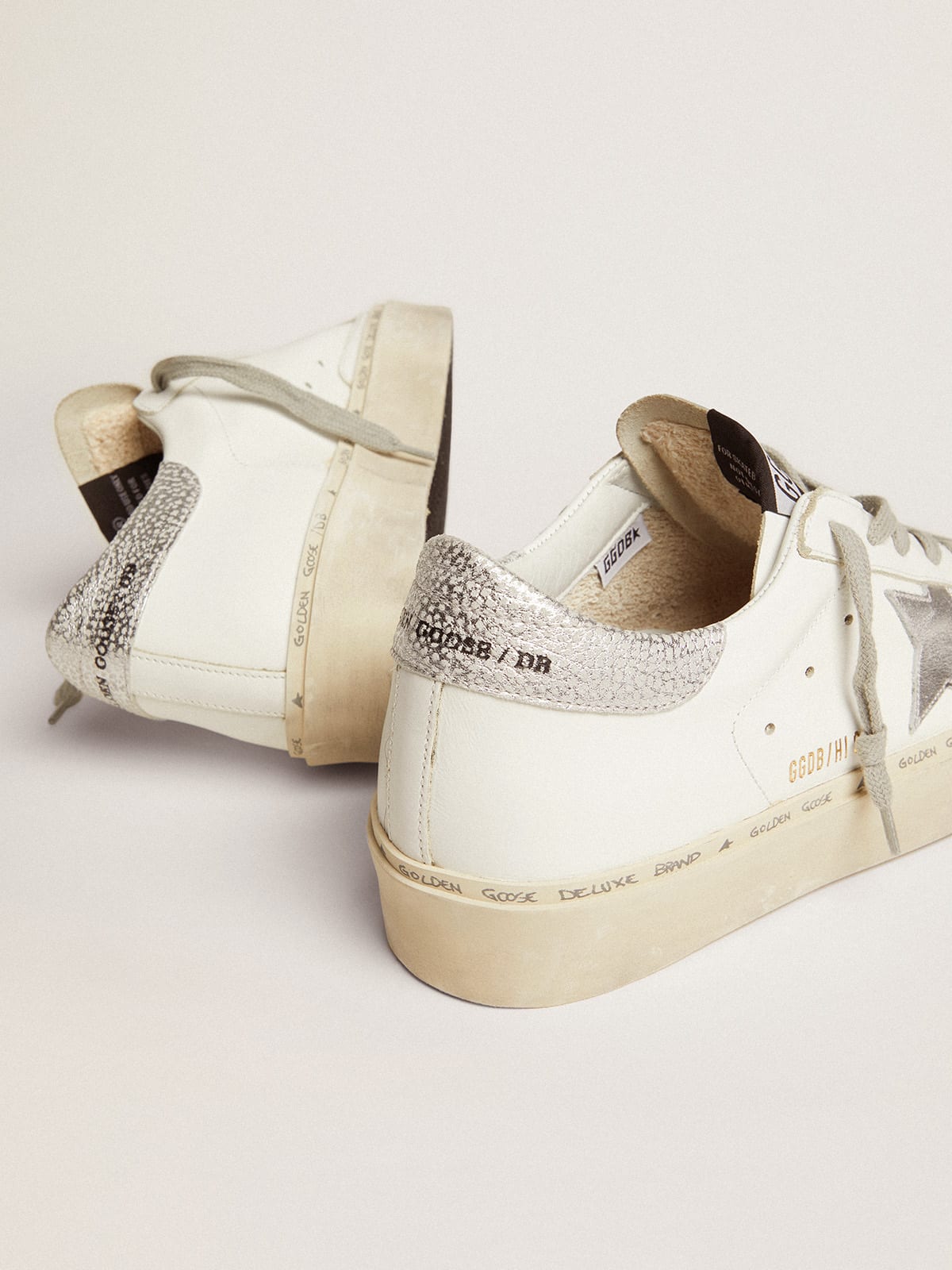Sneakers Hi Star con stella e talloncino in argento metallizzato