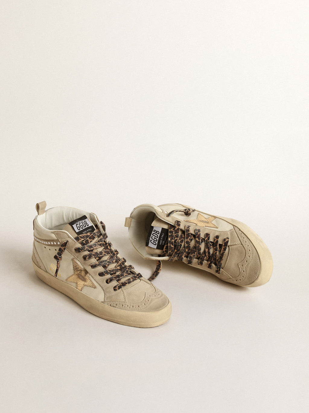 Mid Star con stella in pelle laminata e virgola con cristalli