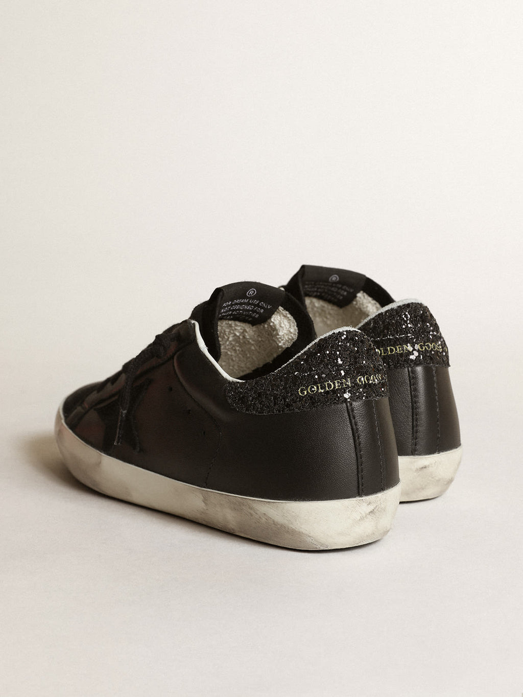 Sneaker Super-Star in nappa nera con stella in suede nero e talloncino in glitter neri