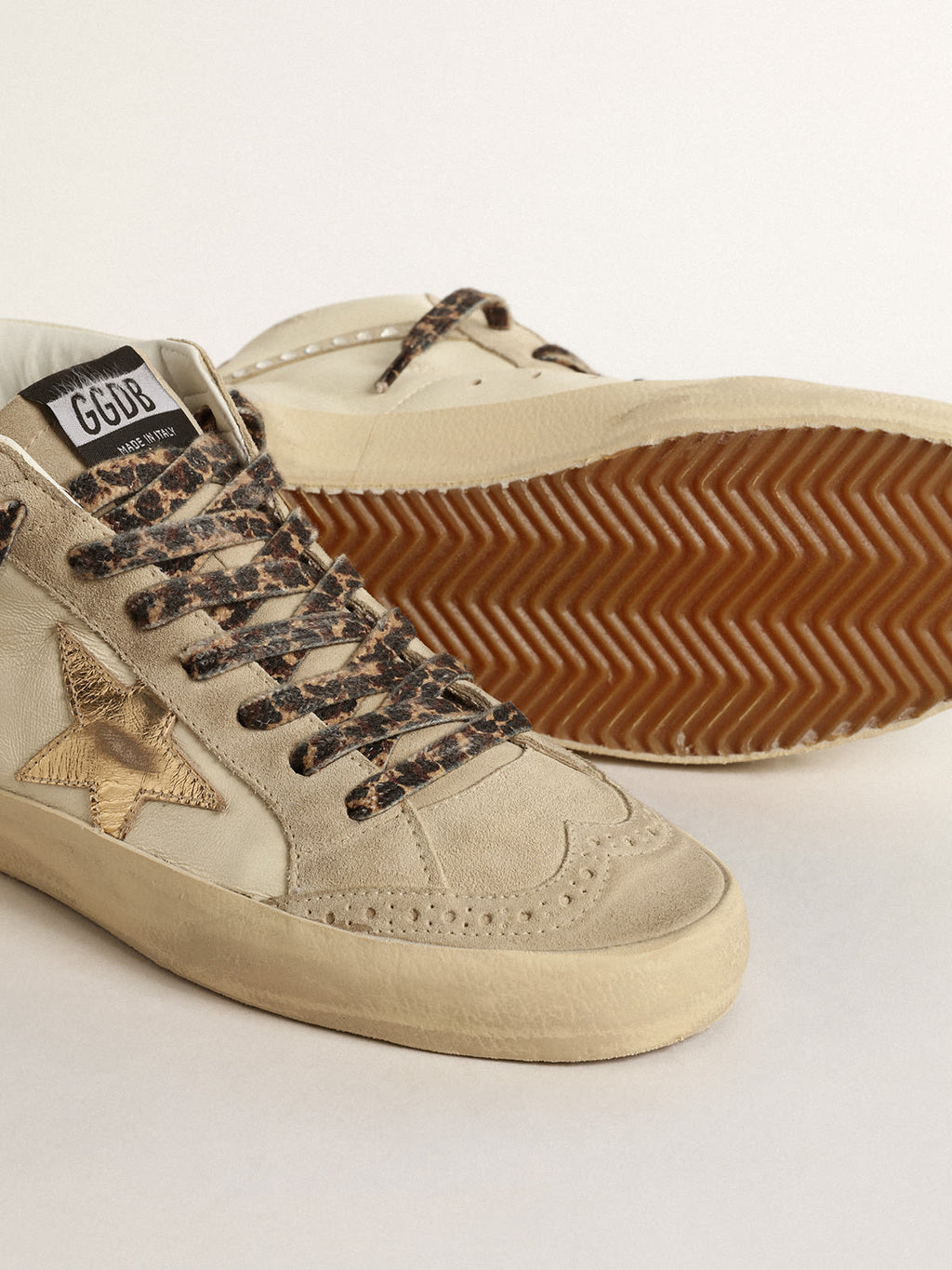 Mid Star con stella in pelle laminata e virgola con cristalli