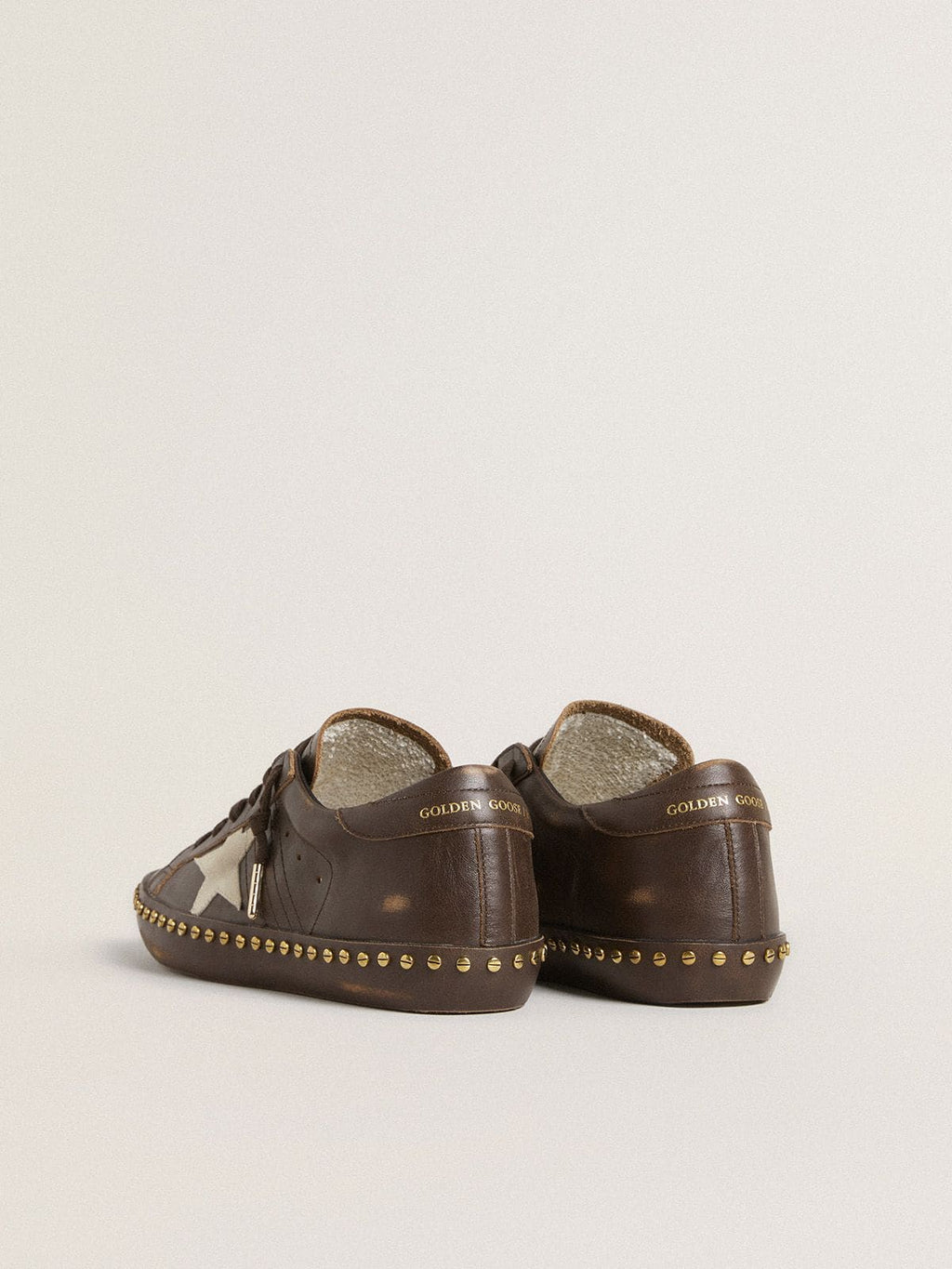Women’s Super-Star in dark brown leather with cream suede star and studs