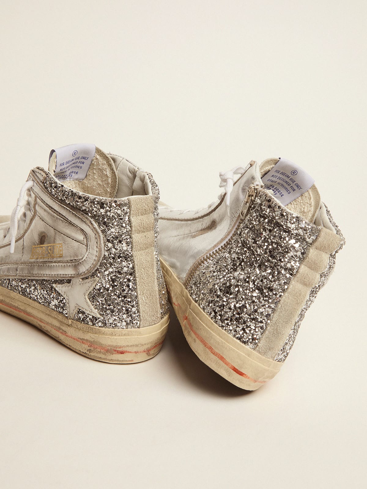 Sneaker Slide con tomaia in pelle laminata e glitter argento
