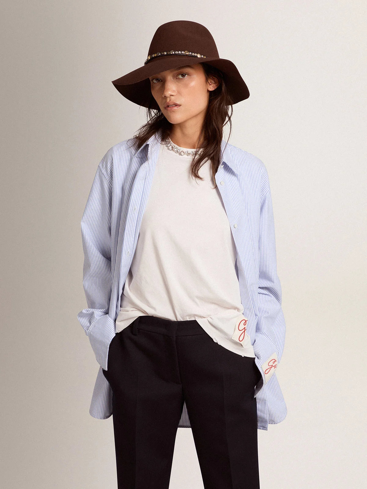 Camicia da donna con righe a bastoncino di colore azzurro