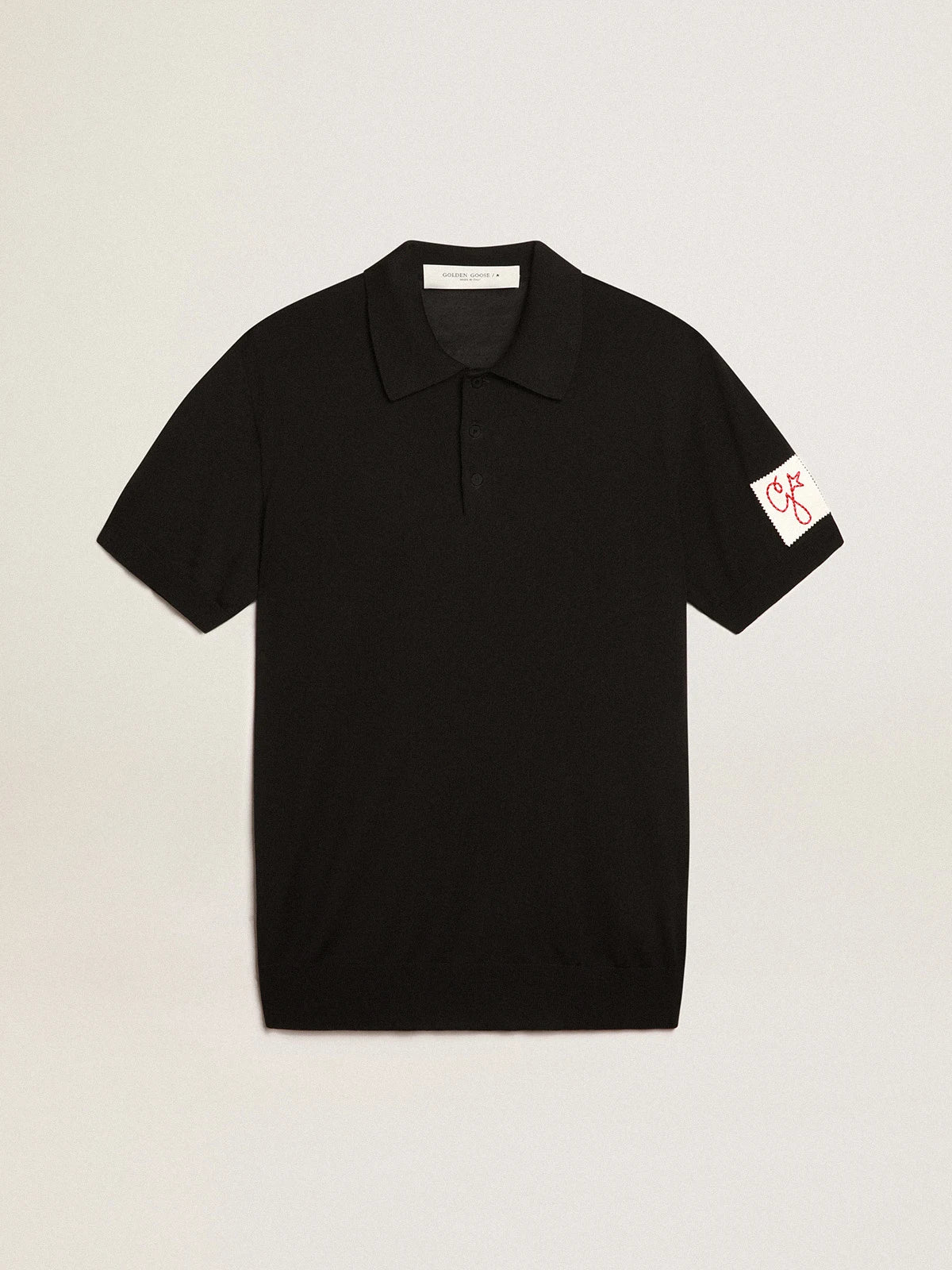 Polo maniche corte da uomo in lana merino di colore nero